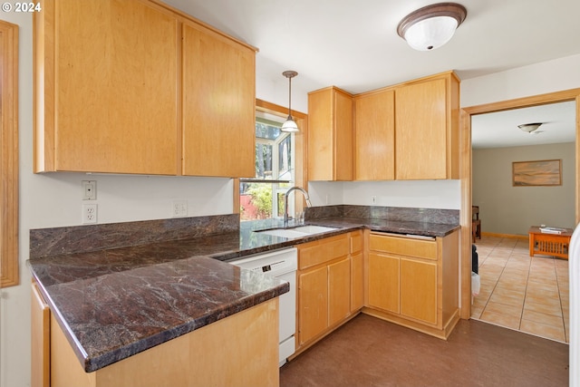 kitchen featuring tile patterned floors, pendant lighting, light brown cabinets, sink, and white dishwasher