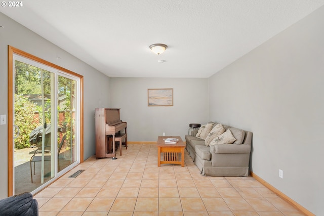 living area with light tile patterned floors