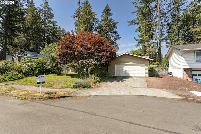 obstructed view of property featuring a garage and an outdoor structure