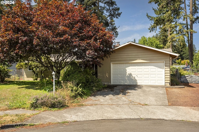 view of front of home with a garage and a front yard