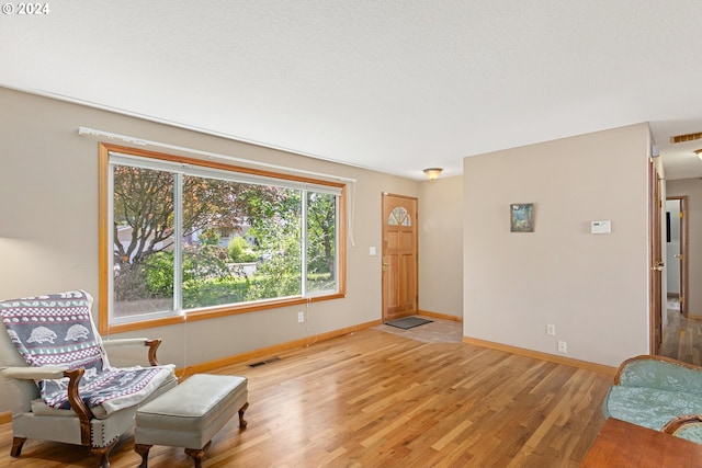 sitting room featuring light hardwood / wood-style flooring