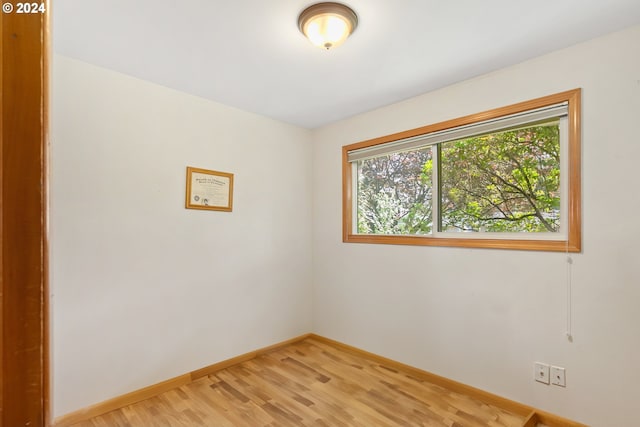 spare room featuring light hardwood / wood-style floors