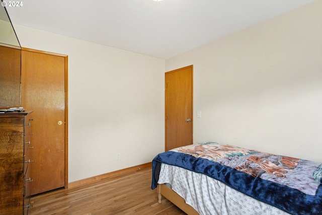 bedroom with light hardwood / wood-style floors