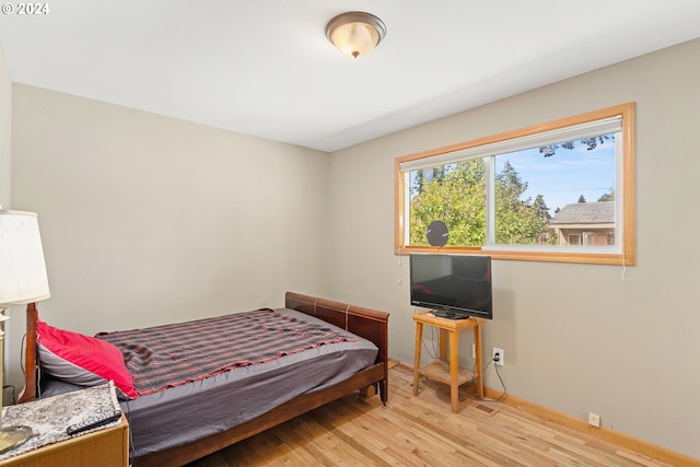 bedroom with light hardwood / wood-style flooring