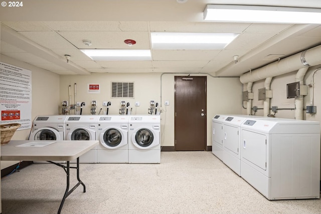 clothes washing area featuring washing machine and clothes dryer