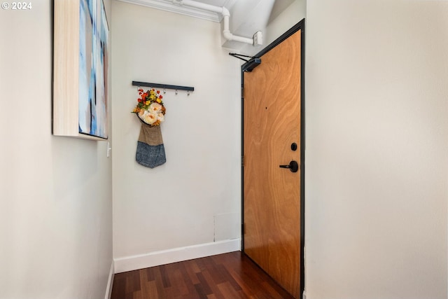 hallway featuring dark hardwood / wood-style flooring