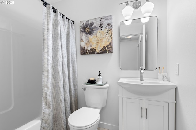 full bathroom featuring vanity, shower / bath combination with curtain, and toilet