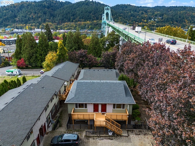 birds eye view of property featuring a mountain view