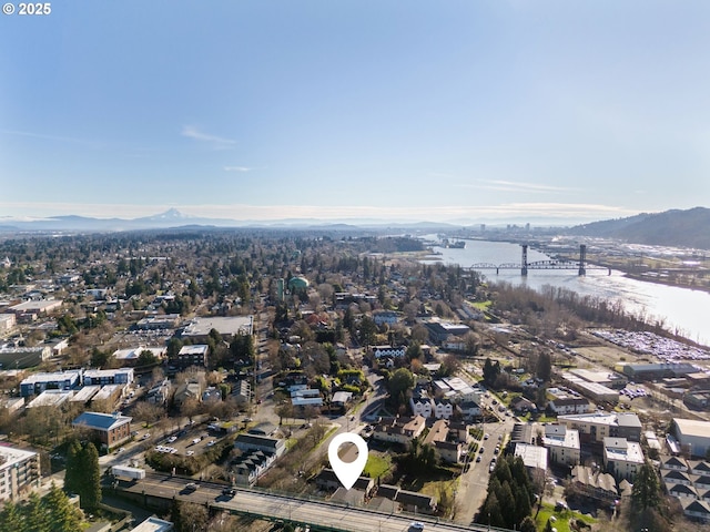 bird's eye view with a water and mountain view