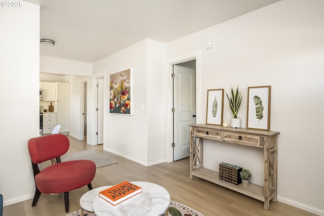 sitting room with light hardwood / wood-style floors