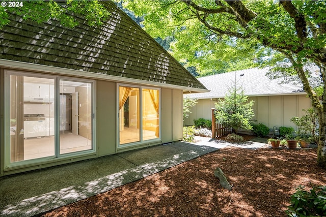 rear view of house with board and batten siding