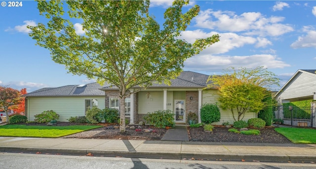 single story home with a front yard