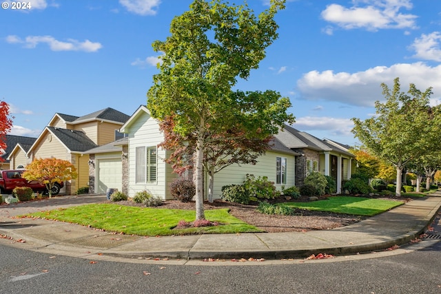 view of front of property with a garage and a front yard