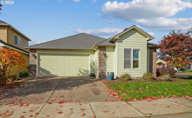 view of front facade with a garage and a front lawn