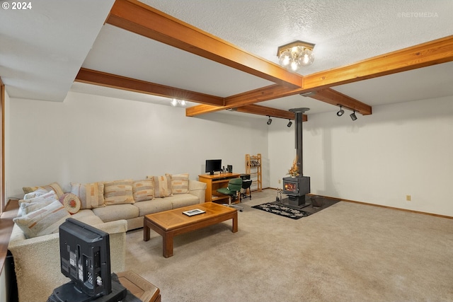 carpeted living room featuring beamed ceiling, a textured ceiling, and a wood stove