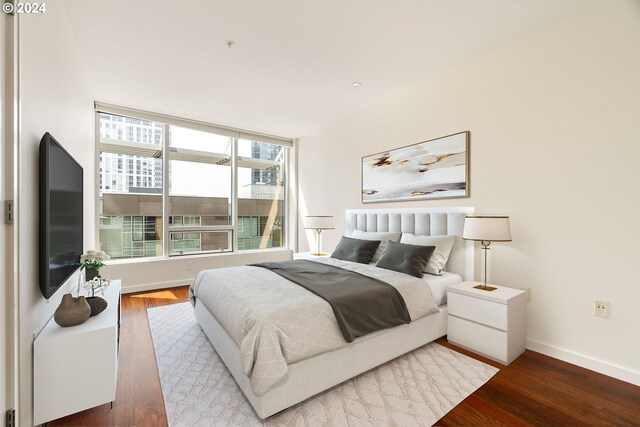 bedroom with hardwood / wood-style flooring