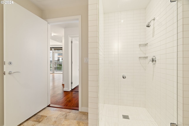 bathroom with a tile shower