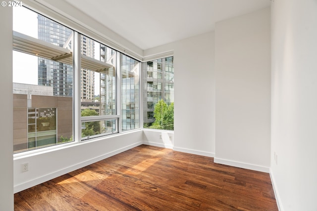 spare room with dark hardwood / wood-style flooring