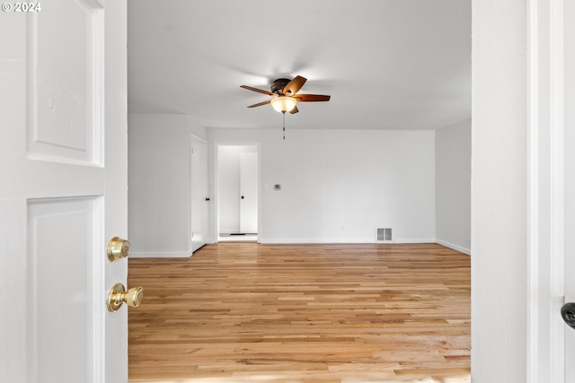 spare room with ceiling fan and light hardwood / wood-style floors