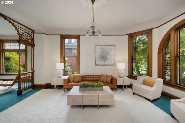 sitting room featuring carpet and a notable chandelier