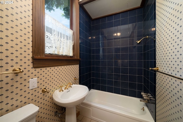 bathroom featuring tile patterned floors, toilet, and shower / tub combination