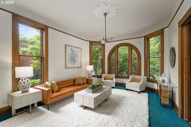 living area with carpet floors and an inviting chandelier