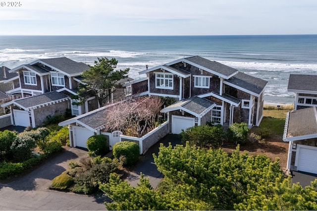 aerial view with a water view and a view of the beach