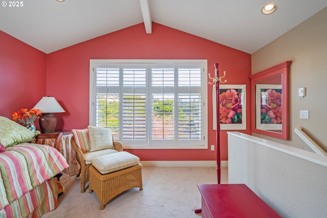 sitting room with lofted ceiling with beams and light carpet