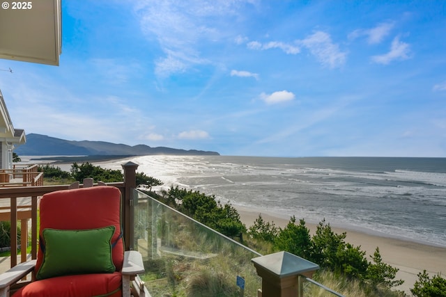 balcony with a beach view and a water view