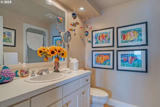 bathroom with vanity, tile patterned flooring, and toilet