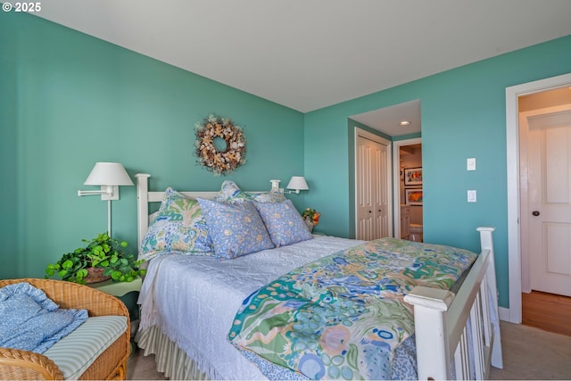 carpeted bedroom featuring a closet