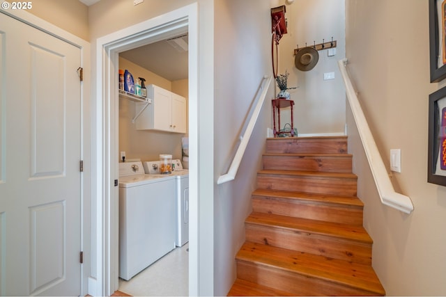 stairway featuring washer and dryer