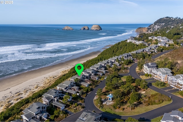 drone / aerial view with a view of the beach and a water view