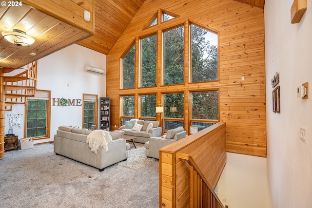 carpeted living room with an AC wall unit, wood walls, high vaulted ceiling, and wooden ceiling