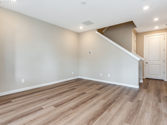 unfurnished room with light hardwood / wood-style flooring