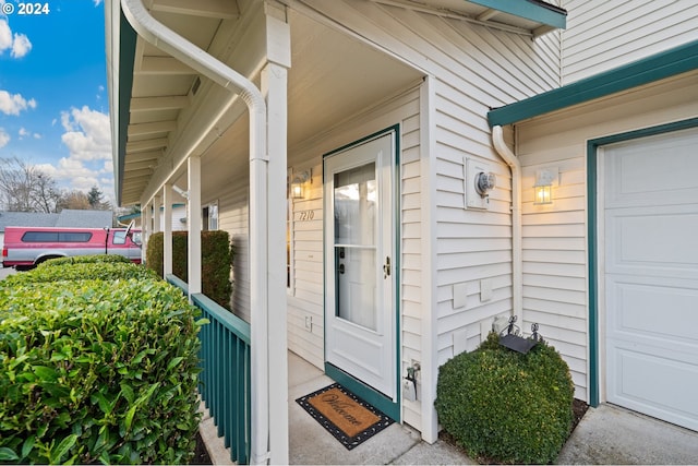 doorway to property with covered porch