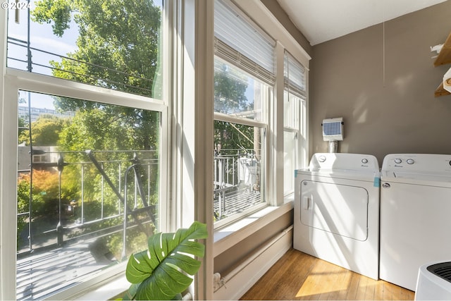 washroom with independent washer and dryer and hardwood / wood-style floors