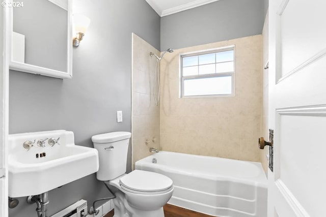 bathroom with toilet, wood-type flooring, tiled shower / bath combo, and crown molding