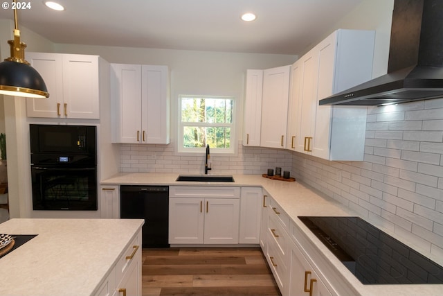 6018 Little Woahink Dr, Florence, OR 97439 - kitchen featuring wall chimney exhaust hood, black appliances, white cabinets, wood finished floors, and recessed lighting