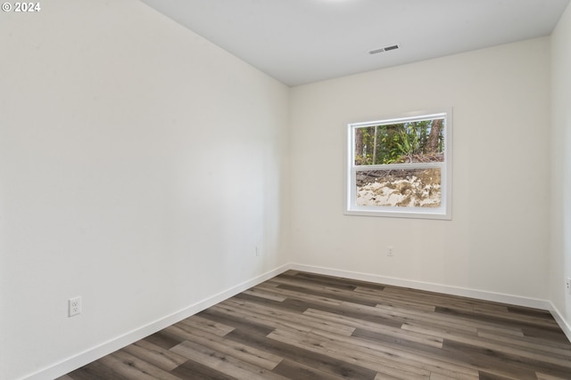 6018 Little Woahink Dr, Florence, OR 97439 - unfurnished room with baseboards and dark wood-style flooring