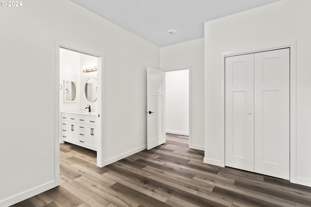6018 Little Woahink Dr, Florence, OR 97439 - unfurnished bedroom with wood finished floors, a closet, and ensuite bathroom