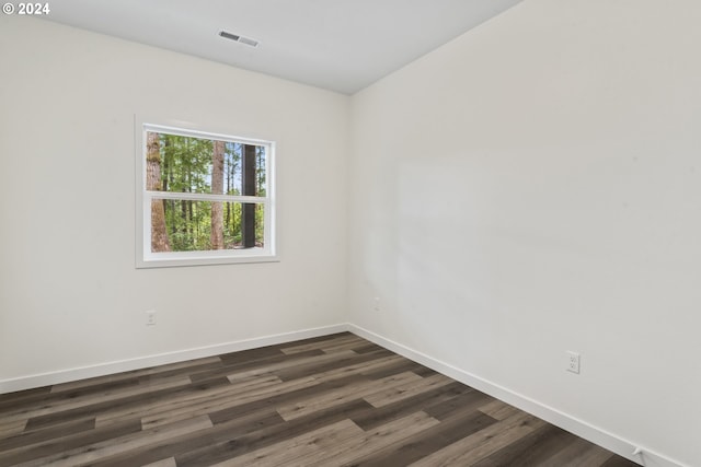 6018 Little Woahink Dr, Florence, OR 97439 - spare room with dark wood-type flooring