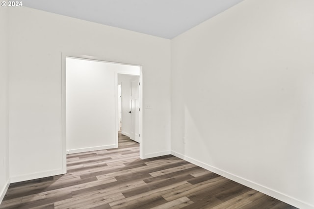 6018 Little Woahink Dr, Florence, OR 97439 - spare room with baseboards and wood finished floors