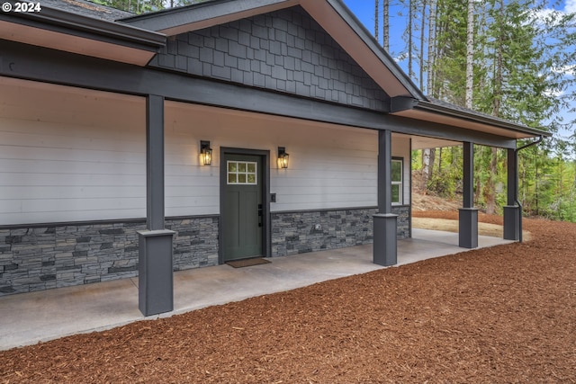 6018 Little Woahink Dr, Florence, OR 97439 - view of exterior entry with stone siding
