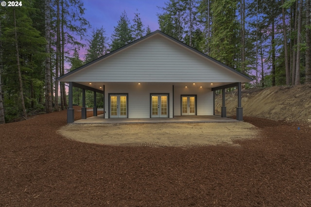 6018 Little Woahink Dr, Florence, OR 97439 - back of house with french doors and a patio