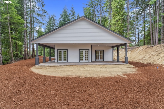 6018 Little Woahink Dr, Florence, OR 97439 - rear view of house featuring french doors and a patio area