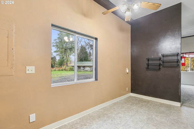 entryway with electric panel, ceiling fan, and a healthy amount of sunlight