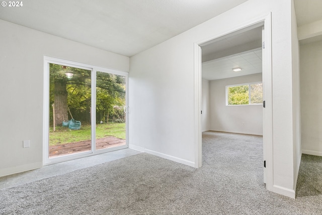 empty room with light colored carpet