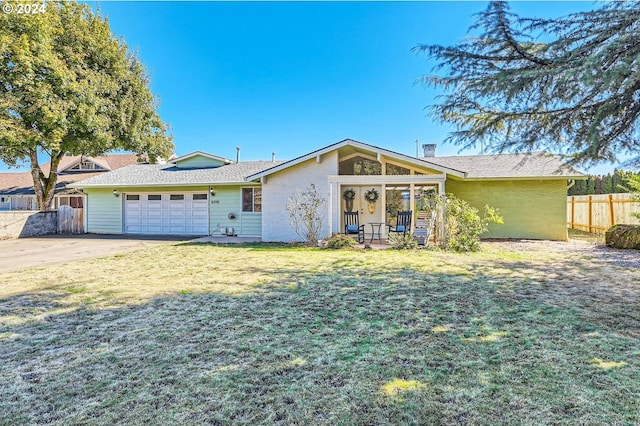 single story home with a front lawn and a garage