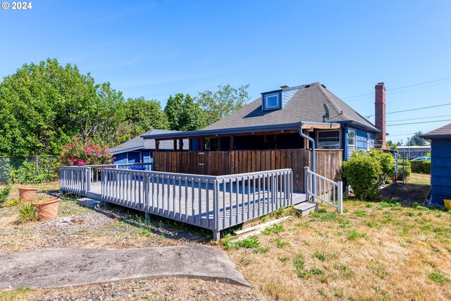 rear view of property with a deck